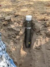 Area of soil that's been removed to show layers.