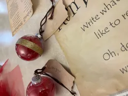 Red holiday ball with gold foil.