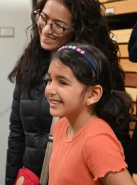 The glow on Valentina's face says it all. She and her parents, Martha Leija and Mario Preciado of Mexico City, recently visited the Bohart Museum of Entomology. The museum maintains a global collection of insects and draws citizens from all over the world. (Photo by Kathy Keatley Garvey)