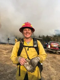Lenya is wearing bright yellow protective gear.