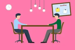 Two men meeting at table