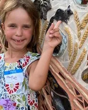 Maple Wallace of Napa points to the squirrel she created. She was part of the community build. (Photo courtesy of Diane Ullman)