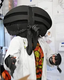 Allen Chew, UC Davis student and artist, in her self-created costume as a horse fly. She also created the invitations. (Photo by Kathy Keatley Garvey)