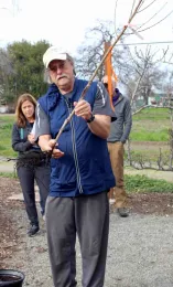 Tom Hansen demonstrates the root system on a bare root fruit tree at Master Gardener workshop. Michelle Graydon