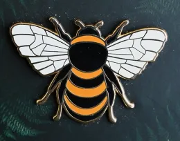 A bee pin available at the Bohart Museum gift shop. (Photo by Kathy Keatley Garvey)