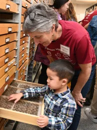 UC Davis distingished professor emerita Lynn Kimsey, talks with 3-year-old Din-Muhammad 