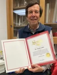 Frank Zalom holds a copy of his Senate proclamation.