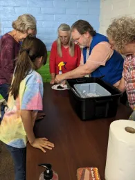 Man showing class a worm bin.