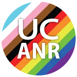 UC ANR in a circle with light blue, white, pink, brown, black, red, orange, yellow, green, royal blue and purple stripes.