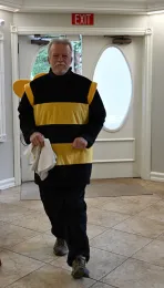 Dr. George Stock enters the museum as half a bee. (He had headed out to his car for a towel to place in the bee costume head. (Photo by Kathy Keatley Garvey)