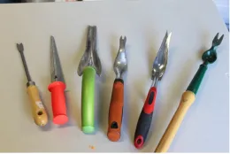 A variety of short-handled tools.