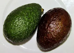 Ripe avocados may have green or black skin.