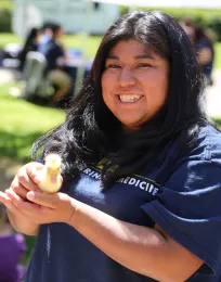 myrna holding a duckling
