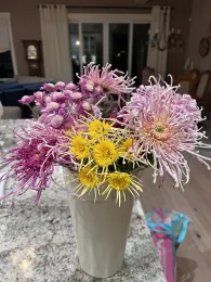 Photo of a bouquet with a variety of chrysanthemums from the garden.
