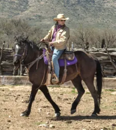 Sarah King on horse back. Sarah is a rancher in Arizona and is our keynote speaker.