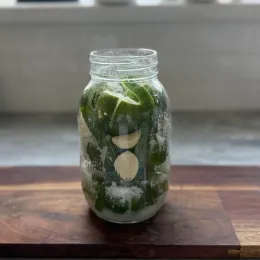 Salted Limes, Jalapenos, and Garlic in a Jar