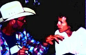 Ellie Rilla, right, talks with Mark Pasternak, Marin grape grower, at the Marin County agri-tourism workshop.