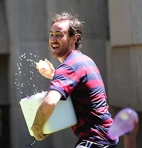 Gabriel Lassabe, immunoassay and nanobody expert from Uruguay, turned into a water warrior at the Bruce Hammock Lab's Water Balloon Battle. (Photo by Kathy Keatley Garvey)