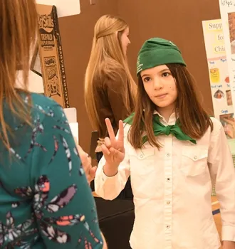 Miriam Laffitte, who is enrolled in a beekeeping project in the Vaca Valley 4-H Club, gestures as she talks about her work. (Photo by Kathy Keatley Garvey)