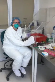UC Davis doctoral student Olivia Winokur working in the Biosafety Level 3 lab (BSL-3) at the School of Veterinary Medicine. (Photo by Cody Steiner)
