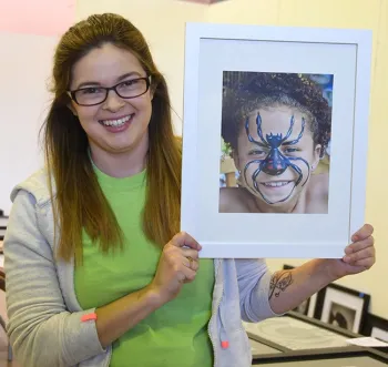Julie Payne, resource leader for Sherwood Forest 4-H Club, Vallejo, holds an image of 