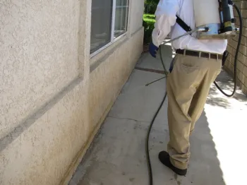 Fig 1. A pest management professional making a liquid application of fipronil. (Credit: Les Greenberg, UC Riverside)