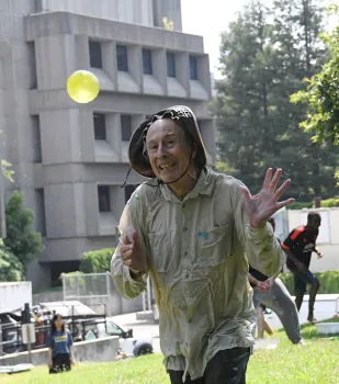 Racing back to his starting line, water warrior Bruce Hammock ducks from tossed balloons. (Photo by Kathy Keatley Garvey)