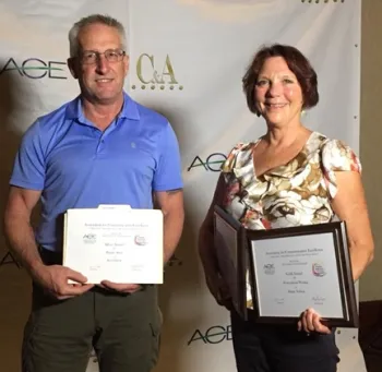 Steve Ellliot, communication coordinator for the Western Integrated Pest Management (IPM) Center, and Diane Nelson, communication specialist with the College of Agricultural and Environmental Sciences, display some of the awards they won at the ACE conference. Nelson won two golds, and Elliott, two silvers and a bronze. (Photo by Pam Kan-Rice)