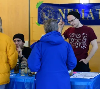 UC Davis doctoral student and nematologist defines nematodes. At left is entomology student Diego Rivera. (Photo by Kathy Keatley Garvey)