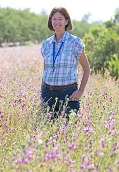 Cooperative Extension advisor Rachael Long next to hedgerows. (Photo by Evett Kilmartin)