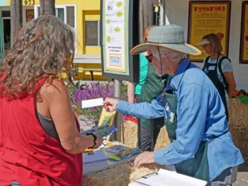 Master Gardener answering questions at the Avocado Festival.