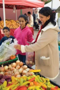Shoppers buying produce at the farmers market