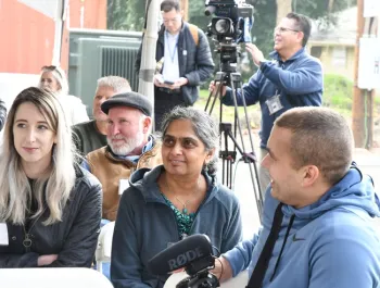 USDA-ARS research entomologists Julia Fine (left) and Arathi Seshadri listen to the speakers. (Photo by Kathy Keatley Garvey)