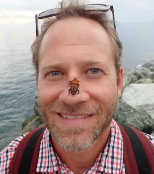 Andrew Sutherland with palm weevil