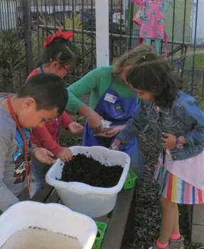 Brenda helping youth in Micah House garden