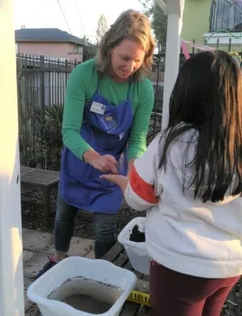 Brenda helping youth learn to garden at Micah House 3