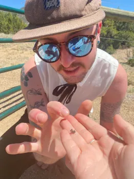 Ecologist Ash Semenick checks out an assassin bug found near Albuquerque, N.M. (Photo by Caroline Larsen-Bircher)