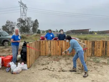 Debbie Cutting Ribbon on Composting Start Day