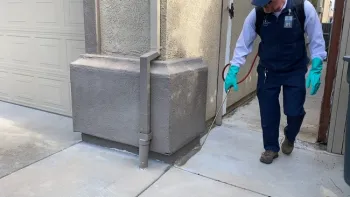 A pesticide application along the perimeter of a house. Photo by Cheryl A. Reynolds, UC IPM.