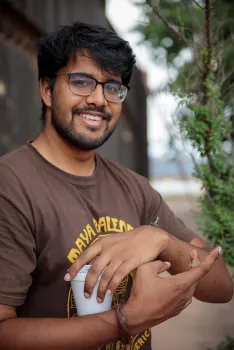 Lohitashwa “Lohit” Garikipati with praying mantids. (Photo by Joel Hernandez)