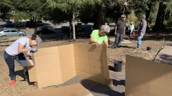 Cardboard being prepared. Gail Mason
