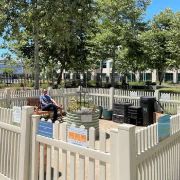 A community member enjoys a quiet moment in the demo garden