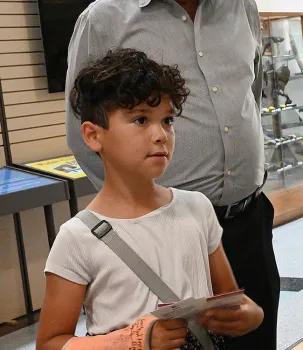 The lure of spiders--Marta Erismann, 8, of Sacramento is curious. (Photo by Kathy Keatley Garvey)