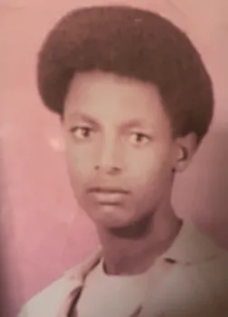 Young man posing for school photo.