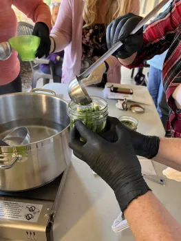 Instructor demonstrating a preservation activity at a library program