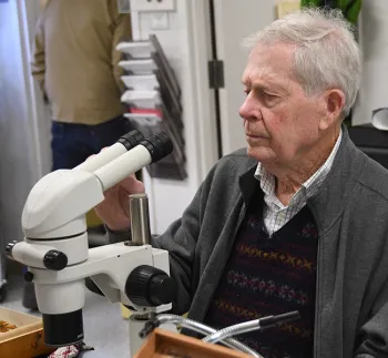 Entomologist and moth expert Jerry Powell identifying insects at the Bohart Museum of Entomology. This image was taken in February 2019. (Photo by Kathy Keatley Garvey)