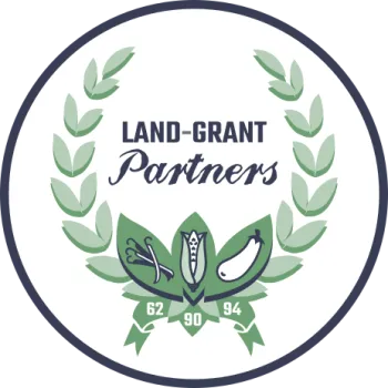 Logo of the Land Grant Summit in a circle formation with green and white lettering around an olive branch