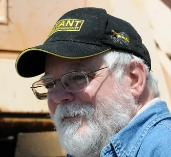 This image of Kim Flottum, taken in 2010 at UC Davis, shows a live bee next to his bee pin. (Photo by Kathy Keatley Garvey)