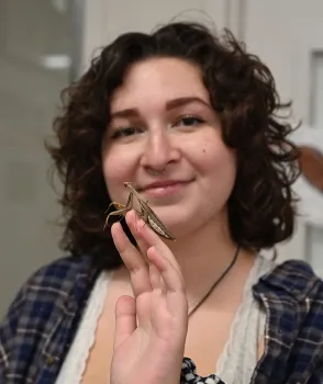 Student entomologist Sol Wantz holding a praying mantis at a recent Bohart Museum of Entomology open house. (Photo by Kathy Keatley Garvey)