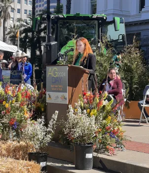 Laurelyn speaks at podium